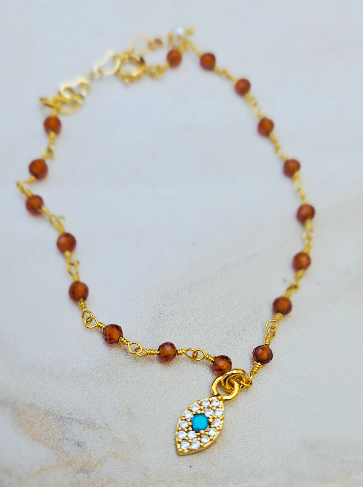 BEADED hessonite evil eye bracelet